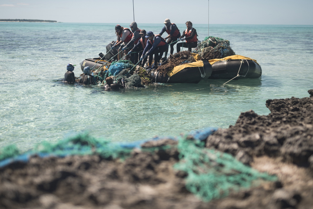 Nets fishing buoys floats boat tangled seaside sea hi-res stock