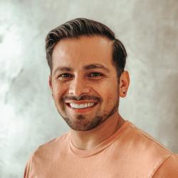 close up of sergio with smile, brown hair and brown eyes