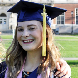 Jennifer in cap and gown from graduation.